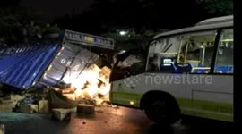 Out-of-control lorry falls on bus injuring four