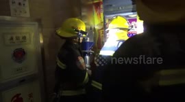 Firefighters rescue panicking people from broken down elevator