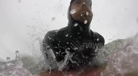 Man surfs rare storm swell in Washington