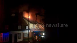 Two children and an adult rescued from a devastating fire which consumed a 150 year old pub
