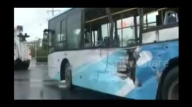 Lorry crashing into bus throws bus driver out of window