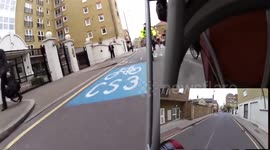 Nutter cyclist passes close, on left, whilst passing car in the door zone.