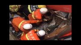 Firefighters rescue two people trapped in collapsed house