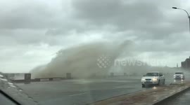 Huge waves crash into pier during Uruguay cyclone