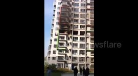 Woman jumps out of the fifth floor of a high building