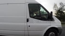 11D33885 White van man texting while driving M50