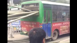 Bamboo sticks on lorry pierce bus