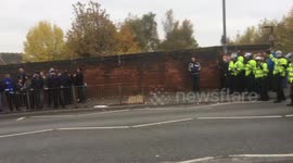 Police Officer Pushes Football Fan To The Ground