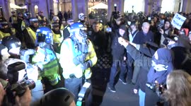 Newsflare Edit - Police officer hit in face with bottle during Anonymous Million Mask March