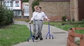 Boy who dreamed of walking alongside his brother takes first steps with him