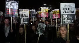 People protest against Trump outside the US Embassy in London