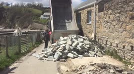 16 ton of Cornish slate dumped on the cliff top coast path at the #loowithaview all to be moved by hand!