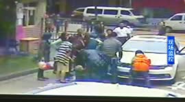 Woman gets foot stuck under car wheel, prompting rescue