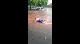 Man 'swims' on flooded road in Johannesburg