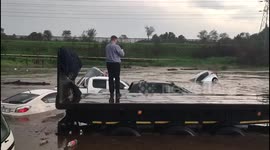 Dozens of cars submerged as highway in South Africa floods