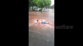 Man 'swims' on flooded road in Johannesburg
