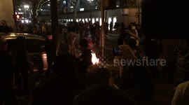 Anti-Trump protestors start fire; refuse to follow police orders to leave.
