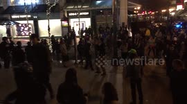 Police fire stun grenades at anti-Trump riot crowd