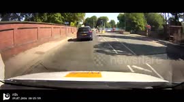 Dashcam of Roundabout error, motorist takes wrong exit on roundabout and ends up head to head with oncoming cars.