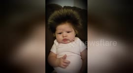 Two-month-old baby with head full of frosted hair!