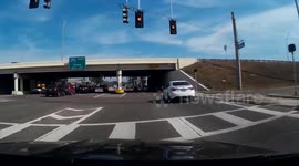 Dump Truck runs red light.