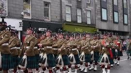 Aberdeen 2016 Armed Forces day parade along Union Street with massed pipe bands & military vehicles