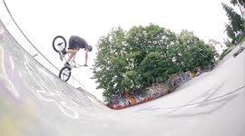 BMX Athlete pulls cool Trick