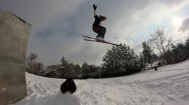 Skier ejects from his skis after epic drop