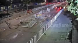 SUV driver runs away after smashing fences on road