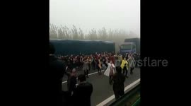 Group of women, stuck in six-hour traffic jam, dance on motorway