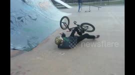 Nasty BMX face plant at skate park