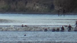 Surfers ride Severn bore in Newnham-on-Severn