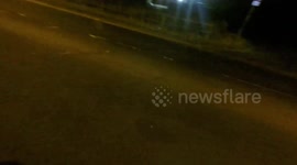 Speeding motorist passing a horse rider