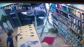 Car smashes into shop because driver presses accelerator by mistake