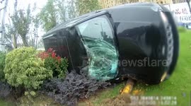 Out-of-control car narrowly misses pedestrian before flipping over