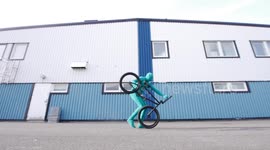 Funny Green Suit Man running with BMX Bike