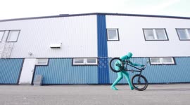 Funny Greensuit Man running with BMX Bike Part 2