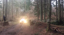 Jumping over a car on a mountainbike.