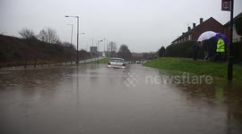 Flooding Caused By Heavy Rain Has Risen To Chest Hight Submerging Cars