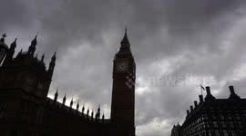 London weather rain and black could above Big Ben, London Eye & Westminster Abbey,London,UK
