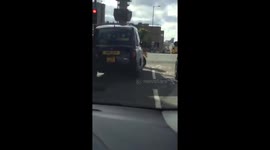Taxi And Biker Have A Fight At Busy Junction