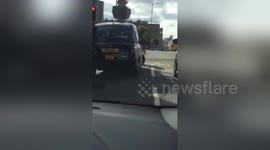 Newsflare Edit - Taxi And Biker Have A Fight At Busy Junction