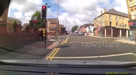 Cyclist Narrowly Avoids Getting Hit by Car