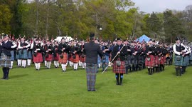 Massed Bands line up in Banchory during North of Scotland Pipe Band competition