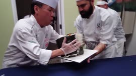 Chefs create giant sushi roll