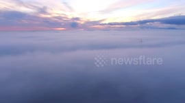 Beautiful drone view from above the fog