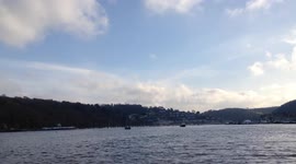 Royal Navy Helicopter Lowers Crew To The Deck Of A Training Vessel