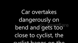 cyclist hits car window