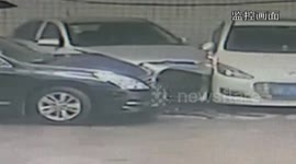 Car slides down slope and hits three cars in garage
