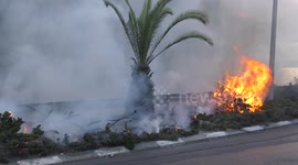 Firefighters spray water in a street in Haifa, Israel.